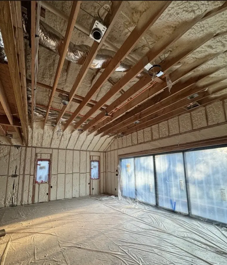 Interior walls and ceiling insulated with spray foam during new construction in Layton